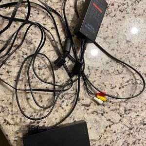 PlayStation 2 with 2 controllers and wires